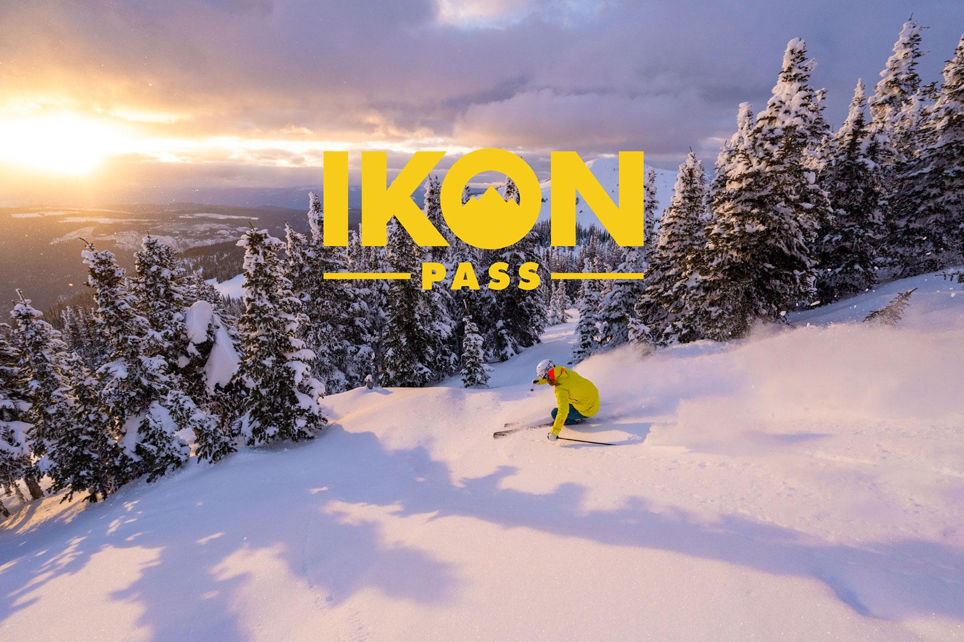 A skier carves into the sunset - Ikon Pass